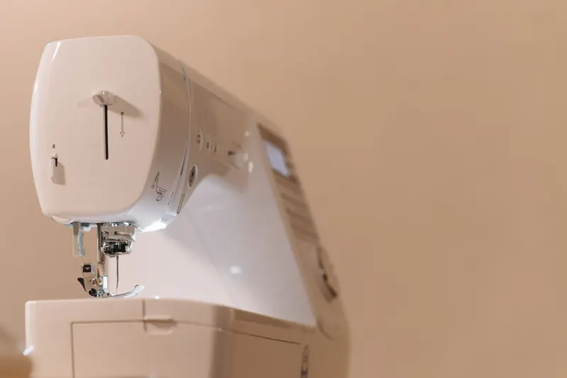 Detailed close-up of a modern sewing machine used in tailoring